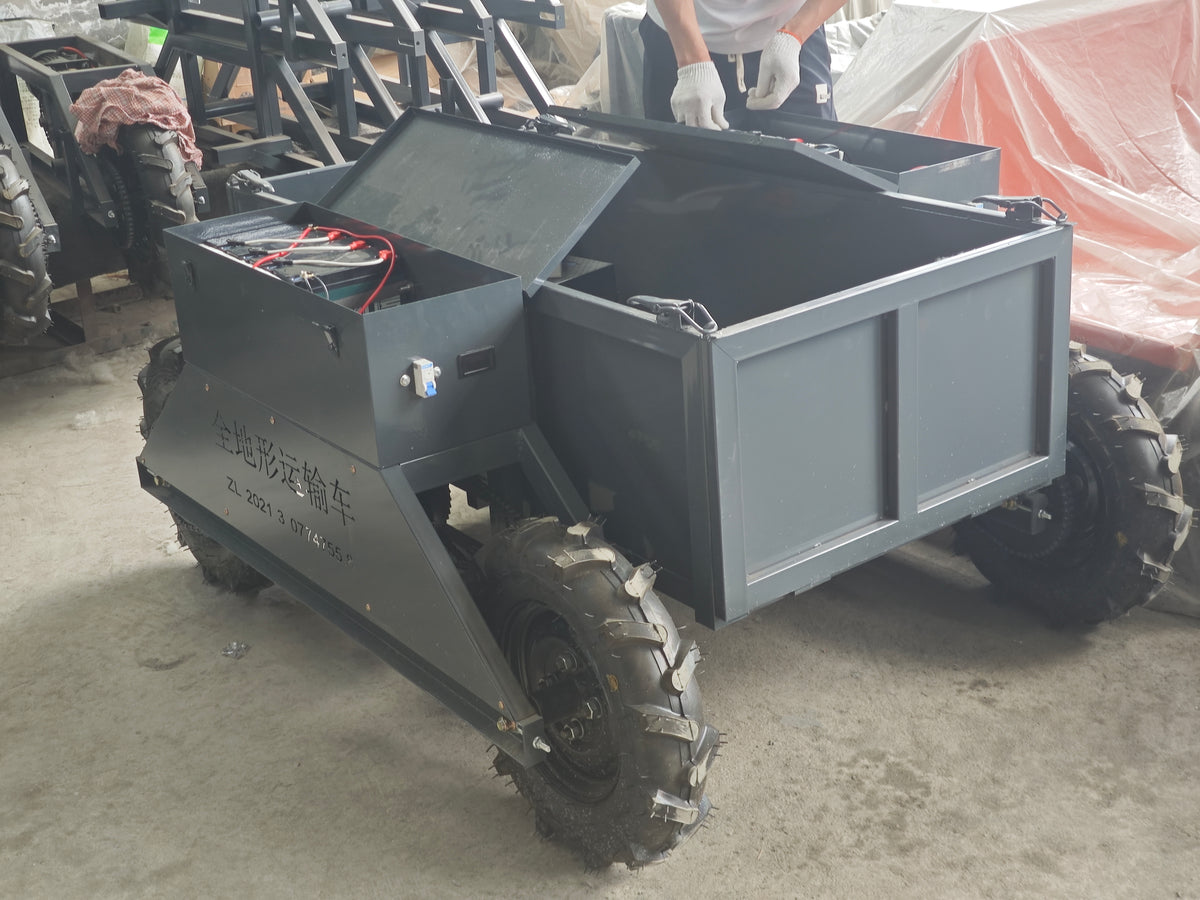 Supplier workshop photograph showing the transporter cargo bed and open equipment compartments